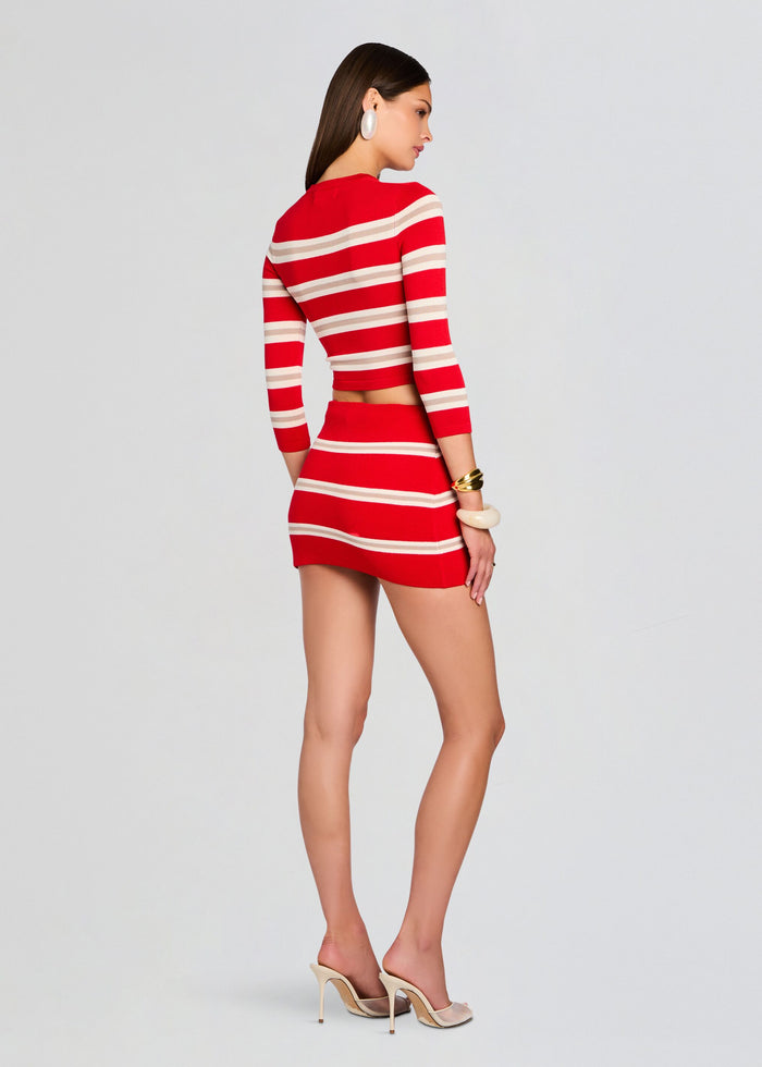 Back view of model in red and cream striped Cruz Knit Top and matching mini skirt media 4 of 5