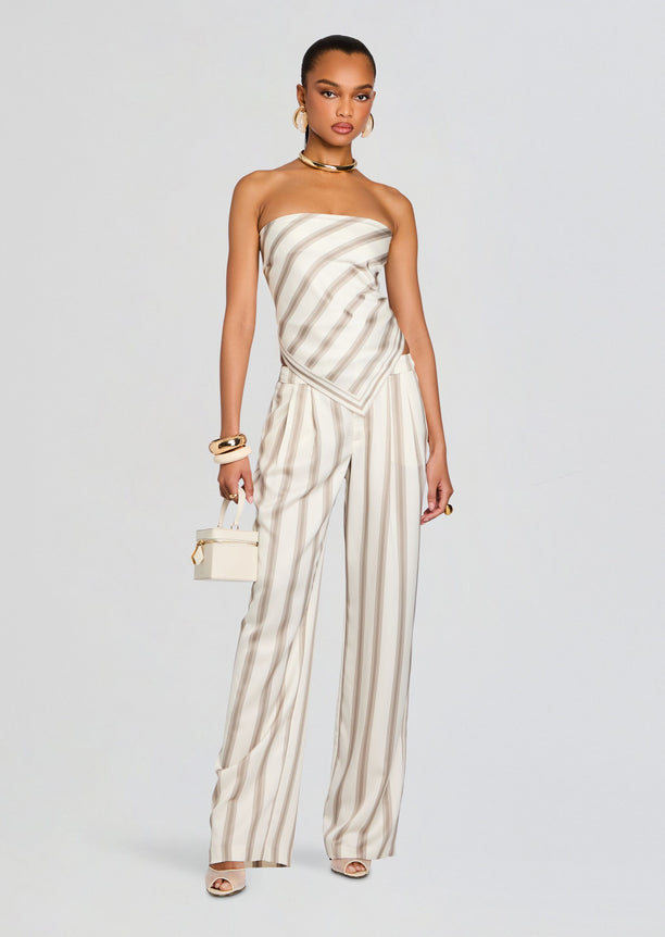Model wearing Marlowe Satin Pant with a striped strapless top and large gold hoop earrings