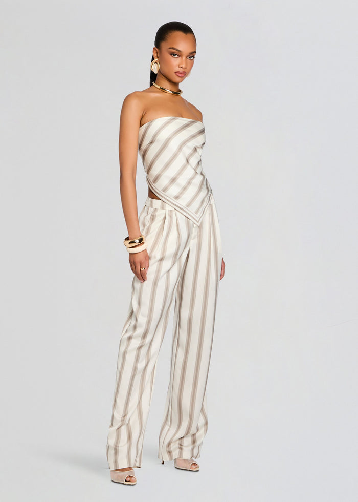 Full-length model wearing the Marlowe Satin Pant set with a striped bandeau top tied at the back. media 4 of 5