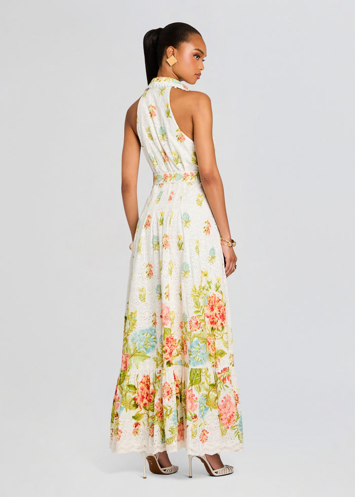 Back view of Dhun Long Shirt Dress featuring a halter neck, sleeveless silhouette, defined waist, and a colorful floral skirt. media 4 of 5
