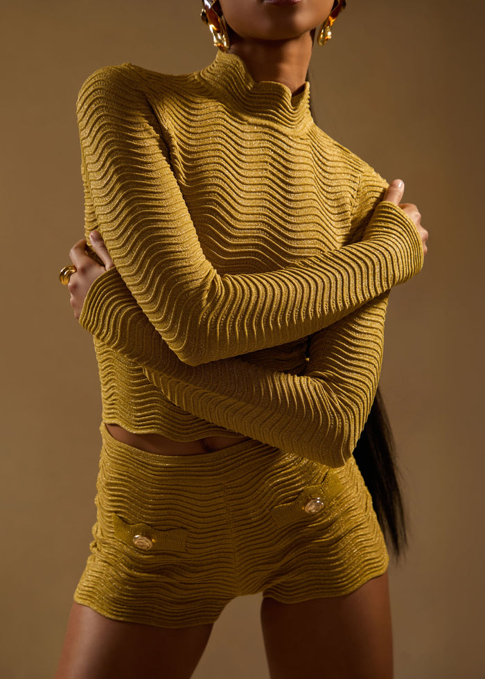 Torso shot of mustard Prissy Knit Top featuring a high neckline and wavy ribbed texture. media 2 of 6