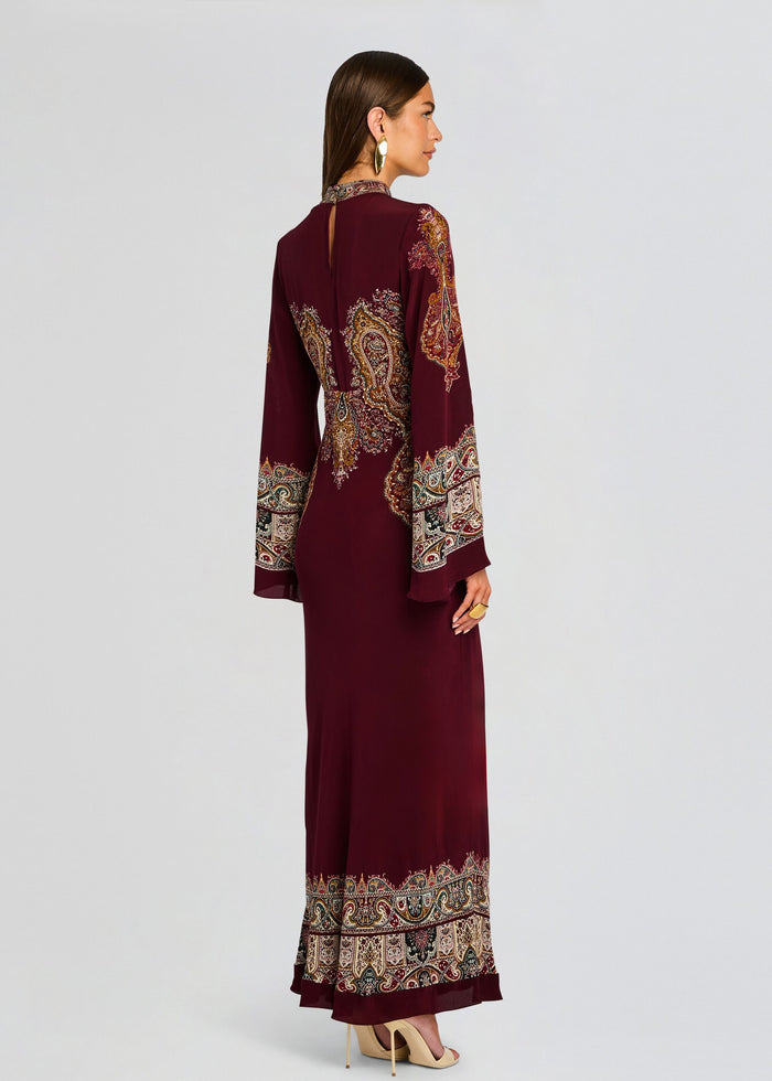 Back view of burgundy Shifa Long Dress showing paisley embroidery on the sleeves and decorative border along the hem. media 4 of 5