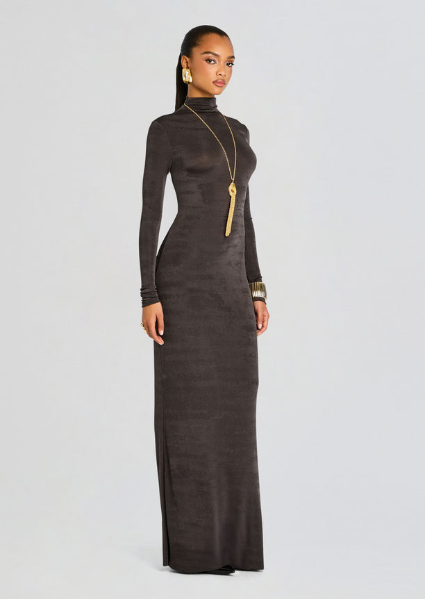 Kim Maxi Dress in dark charcoal velvet worn by model, full length with turtleneck and long sleeves, paired with gold accessories