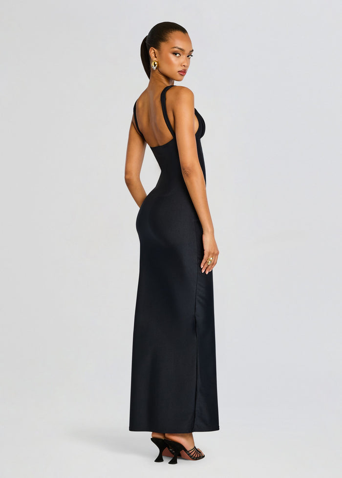 Back view of the Alexandra Maxi Dress showing a low open back and long sleek black silhouette media 4 of 5