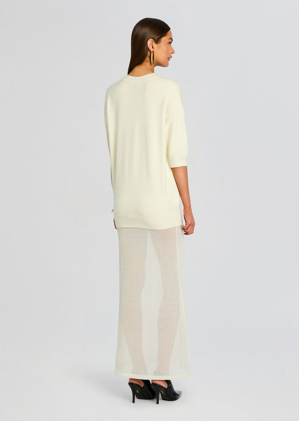 Back view of the Arwen Knit Maxi Dress look showing a cream knit top and sheer maxi skirt