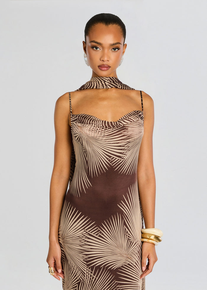 Front view of model in palm leaf print maxi dress with thin straps and a matching neck scarf media 5 of 5