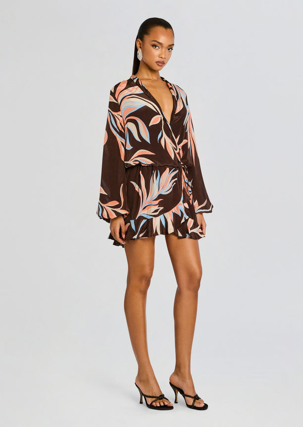 Brown Fern Front Wrap Mini Dress with pastel leaf print, deep V neckline, long bishop sleeves, and a ruffled hem.