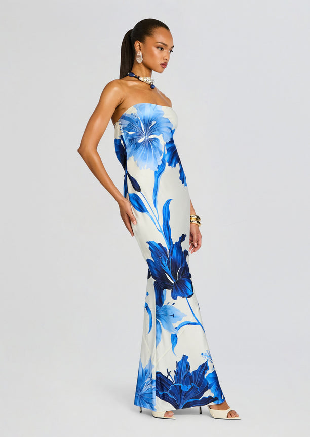 Keaton Silk Dress ivory base with large blue floral print worn strapless by a model in a side view