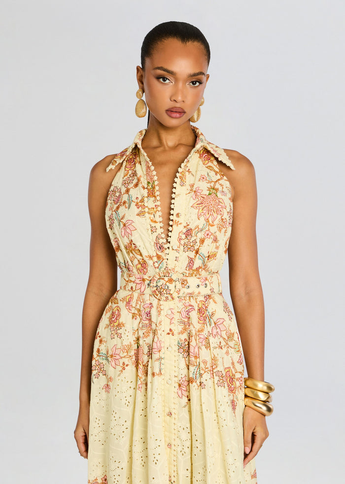 Cream halter neck maxi dress with pastel floral print and matching belt at the waist. media 5 of 5