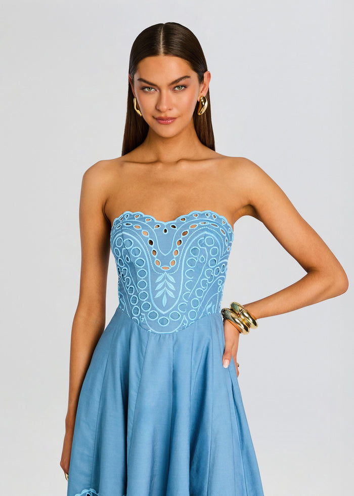 Model wearing a strapless blue Marlin Long Dress with a scalloped embroidered bodice and a full flowing skirt media 5 of 5