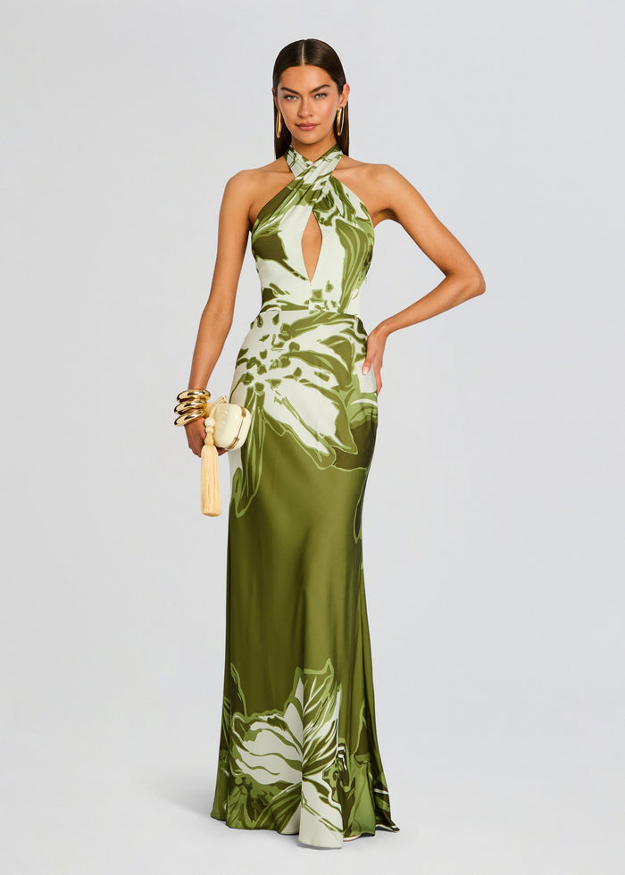 Avo Maxi Dress in olive botanical print, full length halter gown on a model. media 1 of 5