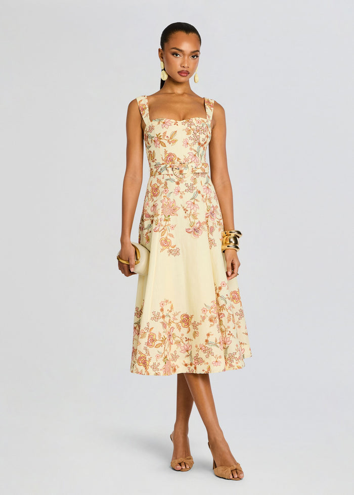 Riah Midi Dress in cream floral print with a matching belt on a model media 1 of 5