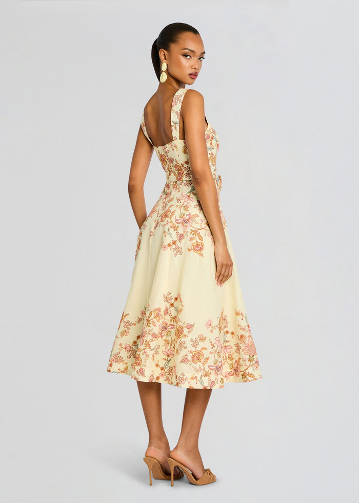 Back view of pale yellow Riah Midi Dress with floral print and belted waist media 4 of 5