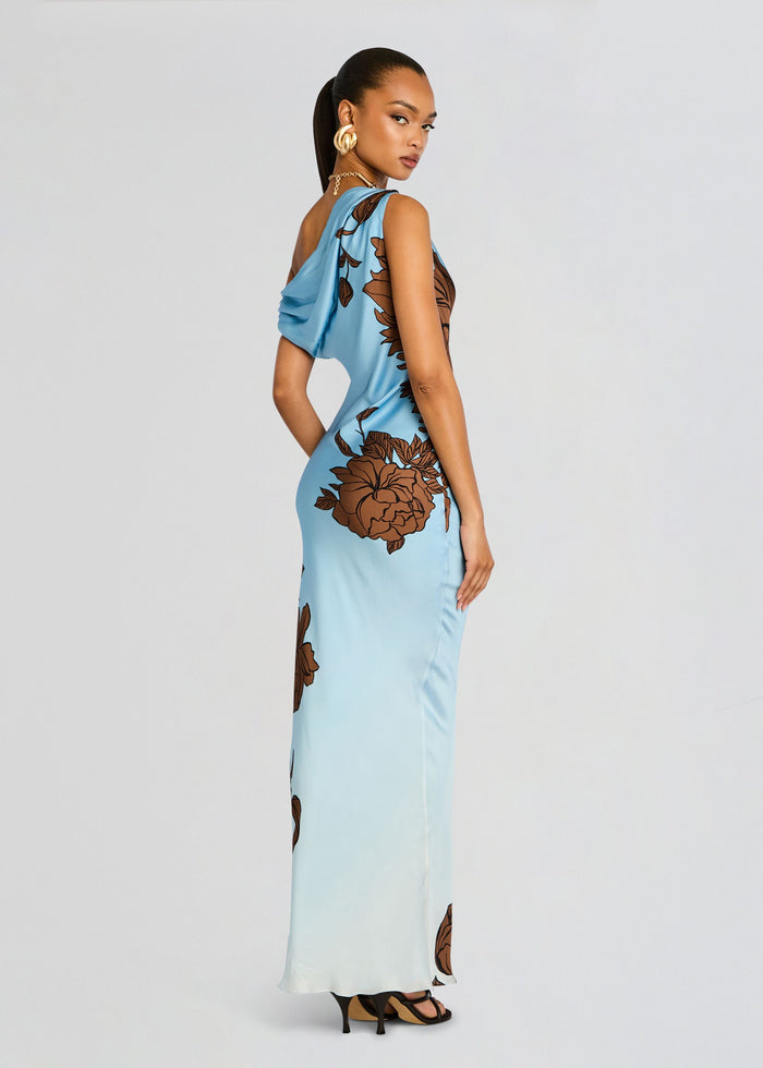 Side view of the Cady One Shoulder Maxi Dress in light blue with large brown floral print. media 1 of 5