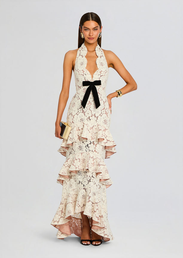 Senara Lace Dress white lace halter gown with black satin bow at the waist and tiered ruffle hem