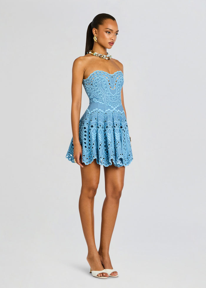 Side view of Bail Short Dress on a model featuring a strapless neckline and scalloped hem media 3 of 5