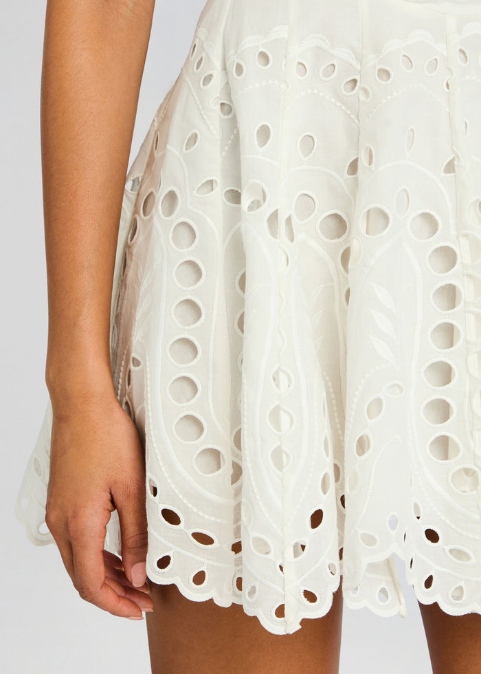 Close up of Bail Short Dress fabric showing white eyelet embroidery and scalloped edges. media 2 of 5