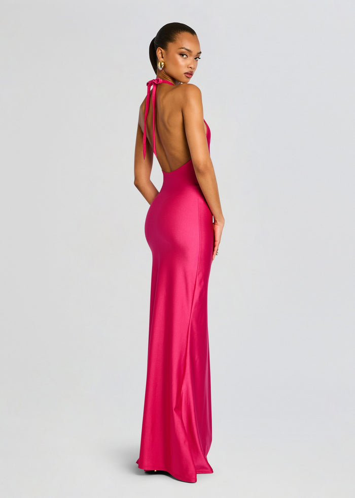 Back view of a magenta halter neck maxi dress with an open back and tied neck media 3 of 4