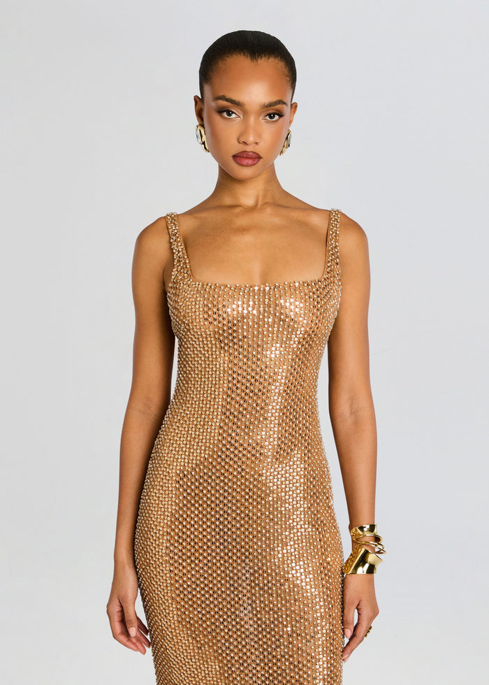 Front view of Xiomara Sequin Dress highlighting the gold sequined fabric and strap detailing on a standing model media 6 of 6