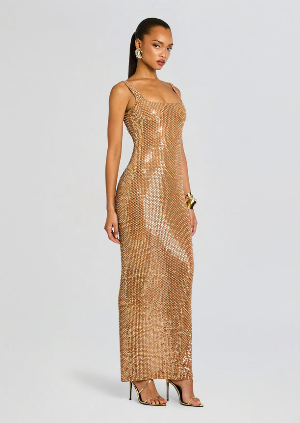 Front view of Xiomara Sequin Dress a gold floor-length sequined gown with straps and a square neckline on a model