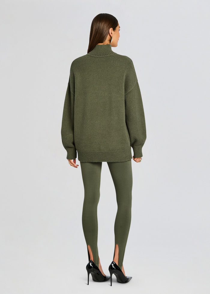 Back view of Beatrice Sweater in olive green with a relaxed silhouette, turtleneck collar, and ribbed cuffs and hem. media 5 of 5