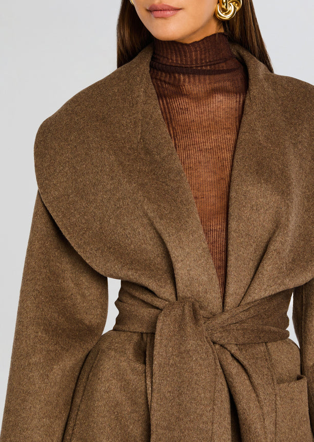 Close-up of a brown Dulcetta wool coat with oversized lapels wrapped at the waist with a belt.