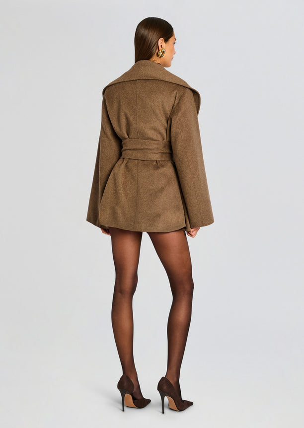 Back view of a brown Dulcetta wool coat tied at the waist, showcasing its structured silhouette.