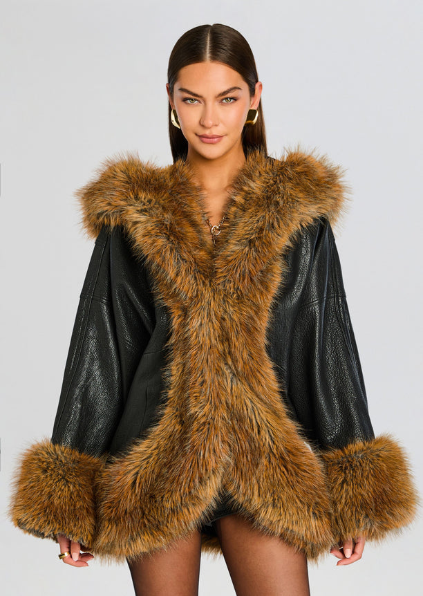 Front view of Laurene Coat with oversized brown fur trim along the open front and cuffs.