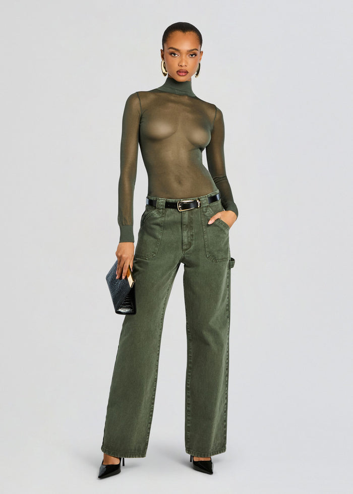 Model wearing Angelique Denim Pant olive green wide leg jeans with a black belt and pointed heels media 2 of 6
