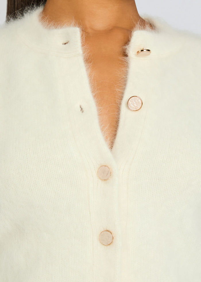 Medora Cardigan ivory knit close up showing gold buttons and soft fuzzy texture. media 3 of 5