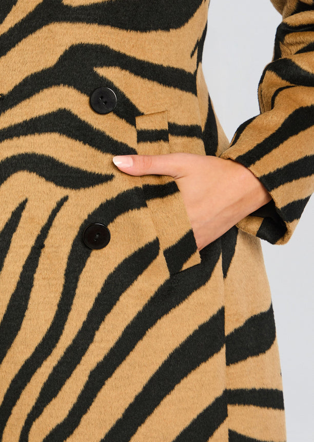 Close up of the tiger stripe pattern on the Petal Coat showing a pocket and button detail.