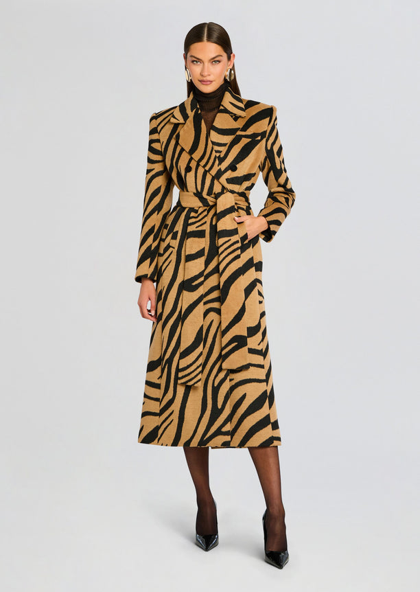 Front view of the camel zebra print Petal Coat belted at the waist model in black heels