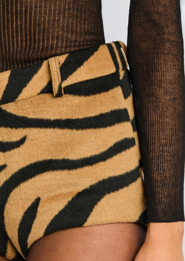 Close up of tiger stripe fabric on the Katerina Short with belt loop and black sheer sleeve.