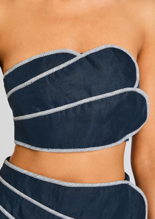 Navy denim bandeau top with white piping along the edges