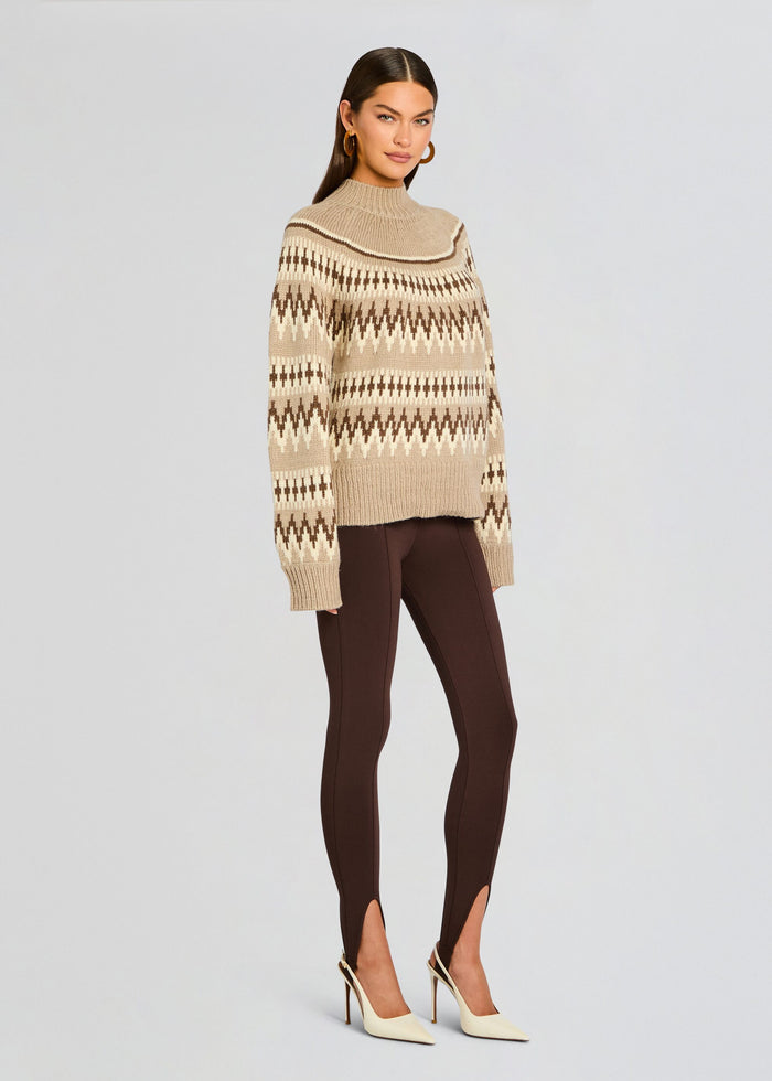 Model wearing Tirza Sweater with brown tapered pants and cream heels in a side pose media 4 of 5