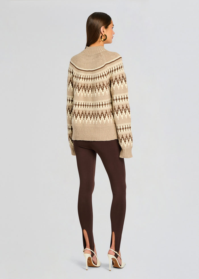 Back view of a beige Tirza Sweater with a brown and ivory geometric pattern, worn with brown pants and cream heels. media 5 of 5