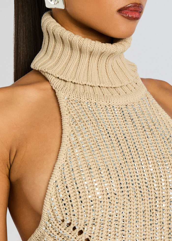 Beige knit turtleneck close-up with crystal embellishments along the bodice media 3 of 6