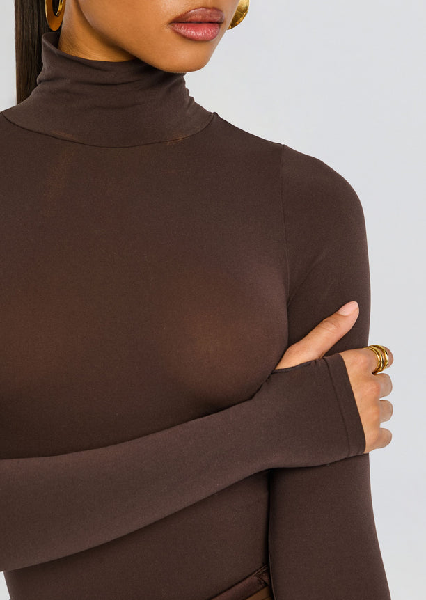Close-up of chocolate brown Ballet Turtleneck Bodysuit highlighting the turtleneck and smooth fabric.