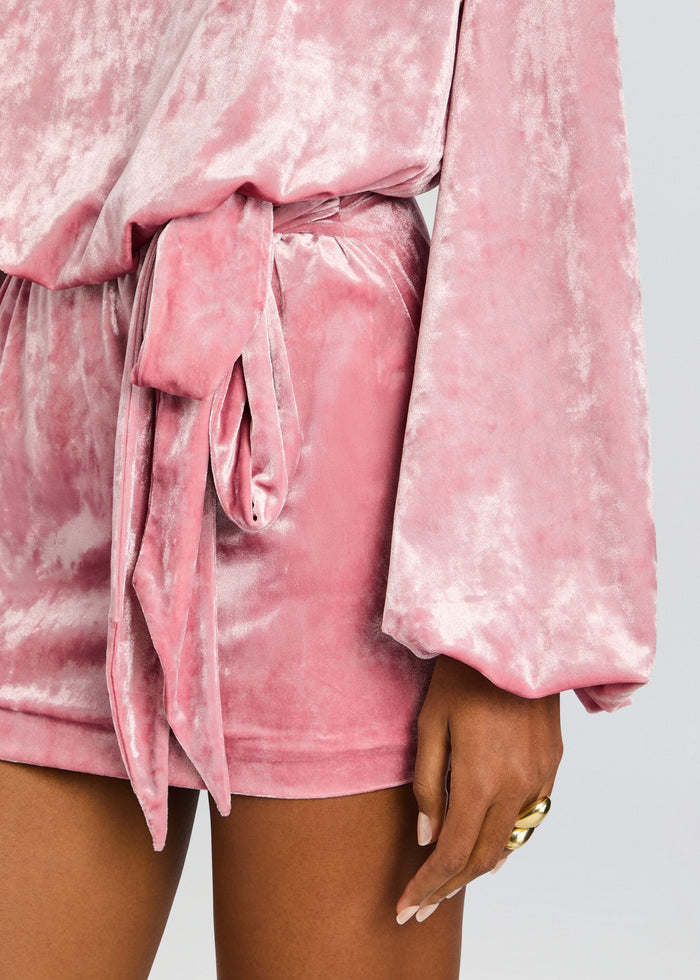 Close up of pink crushed velvet belt tied at the waist of the garment. media 2 of 5