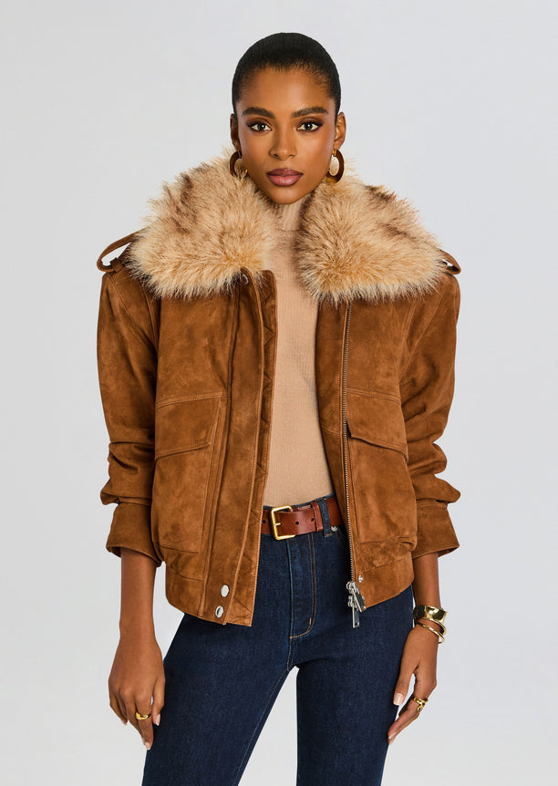 Model wearing a tan Erynn Suede Jacket with a thick fluffy fur collar.