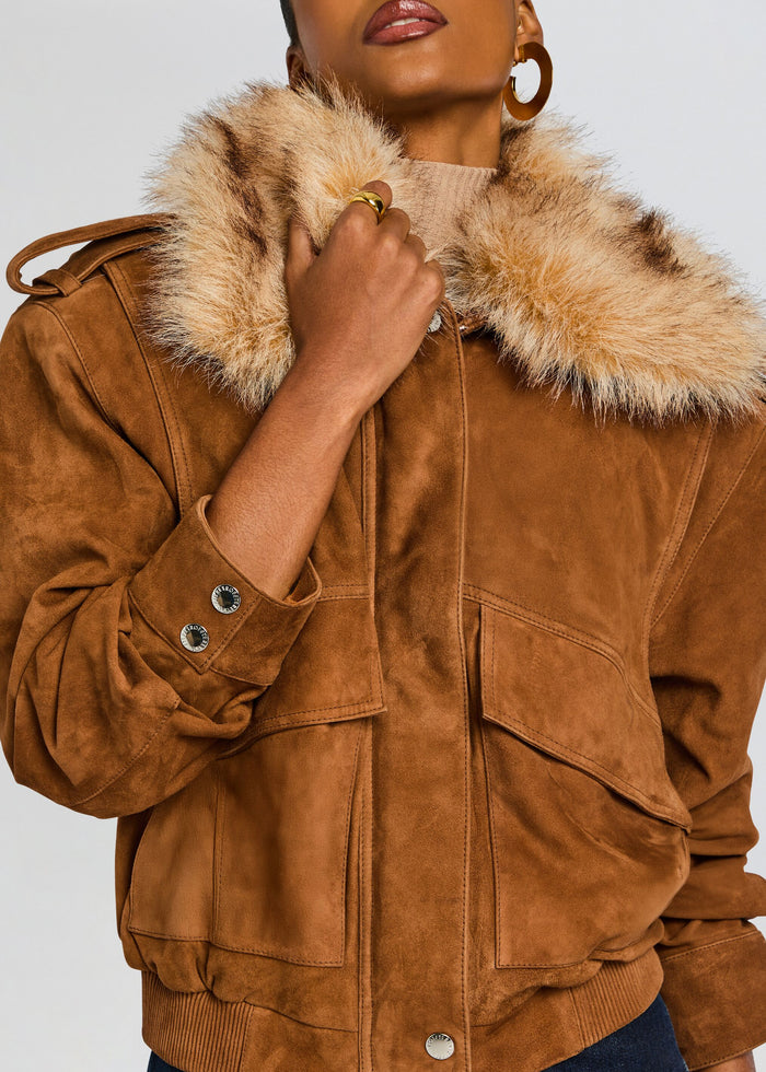 Close up of a tan suede Erynn jacket with a dramatic fur collar and metallic buttons. media 3 of 7