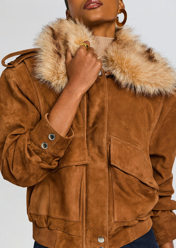 Close up of a tan suede Erynn jacket with a dramatic fur collar and metallic buttons.