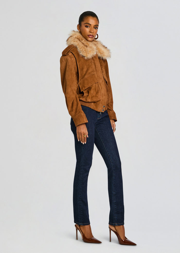 Full body shot of a model wearing the Erynn Suede Jacket with fur collar, dark jeans and brown high heels. media 4 of 7