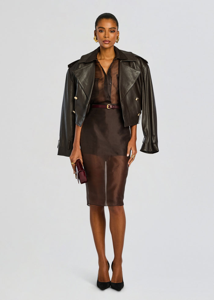 Model in a brown sheer silk midi skirt paired with a sheer top and a black oversized leather jacket media 6 of 6