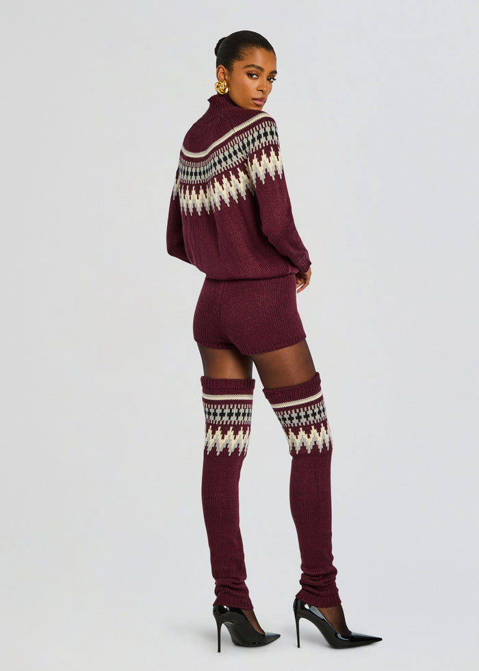 Back view of burgundy Rocky Knit Romper with a patterned yoke and thigh-high knit socks. media 4 of 5