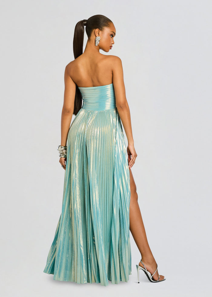 Back view of Sevyn Dress in metallic teal with a strapless ruched bodice and full pleated skirt with a side slit. media 4 of 5