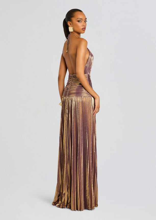 Back view of the metallic pleated Thalia Dress with an open back halter and ruched waist