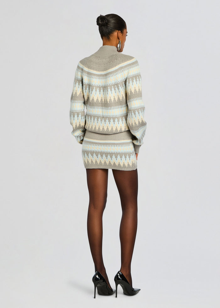 Back view of model in Tirza Sweater and matching knit mini skirt with black stilettos media 5 of 5