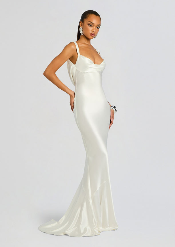 Full length ivory Vinicia Dress in satin with a fitted silhouette and subtle draped neckline.