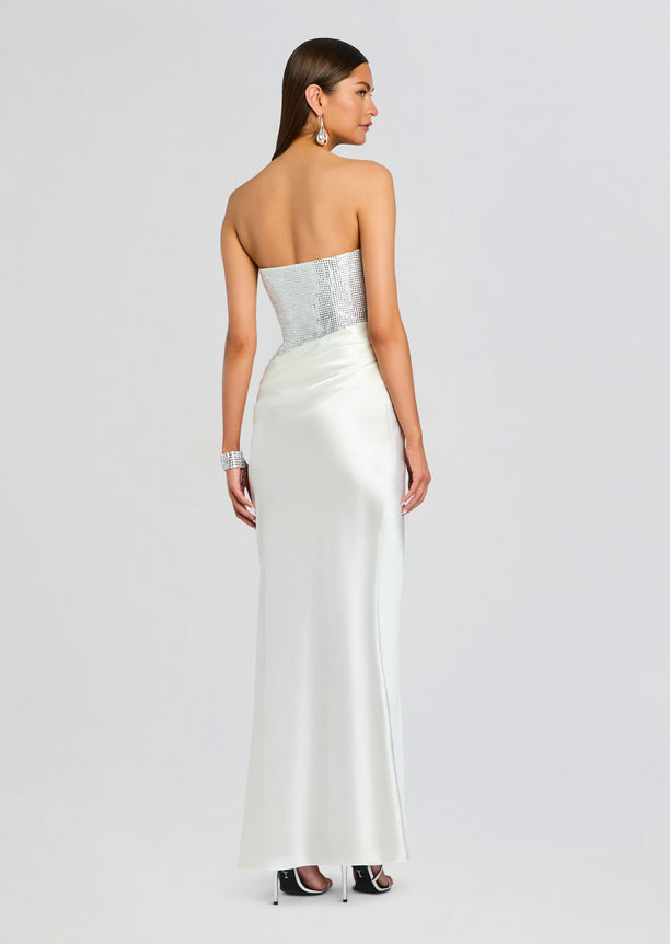 Back view of Alexandra Embellished Dress showing a silver sequined strapless bodice and satin skirt.